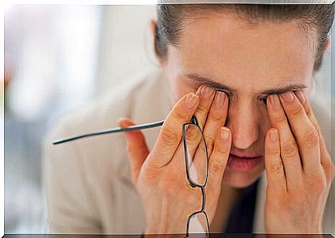 Tired woman with glasses