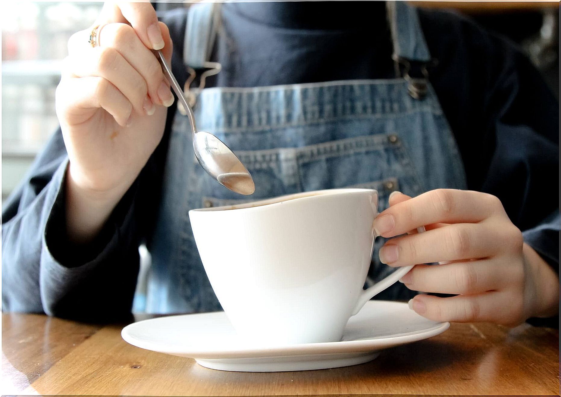 Woman with white cup of tea.