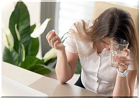 woman takes almotriptan for migraine