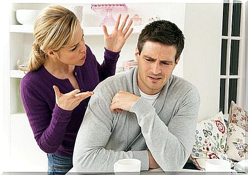 Woman-talking-to-her-husband-while-he-keeps-quiet