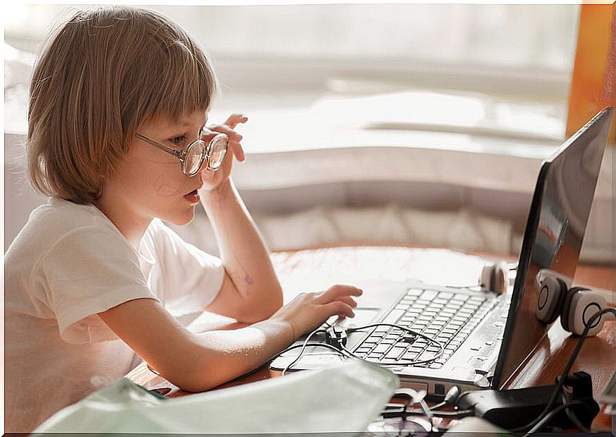 Girls sitting at the computer in bad posture