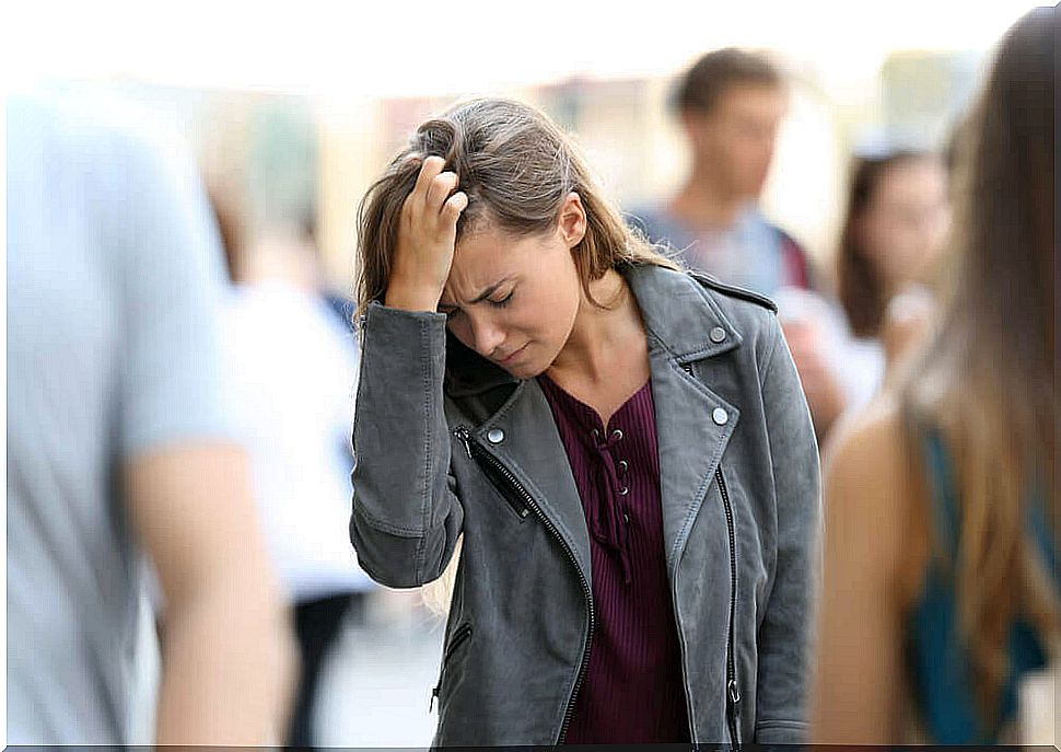 Stressed woman in the crowd.