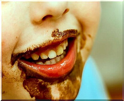 Boy with chocolate on his face