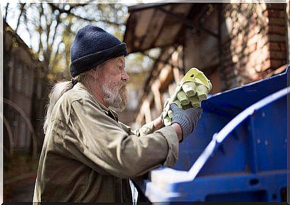 Poor rummaging through the trash